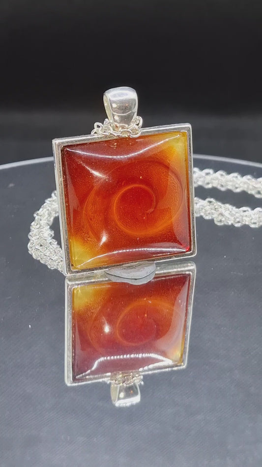 Handcrafted  epoxy and stainless steel pendant